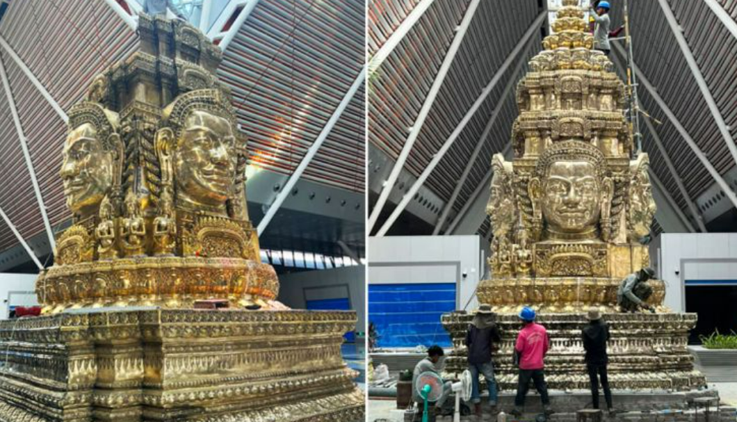 Рабочие устанавливают статую четырехликого Брахмана в международном аэропорту Сиемреап-Ангкор